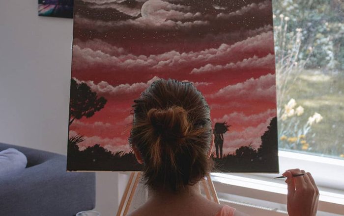 girl painting on a canvas