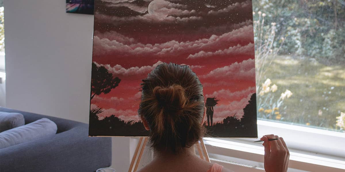 girl painting on a canvas