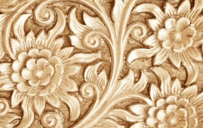 flowers carved into wood to show texture in art