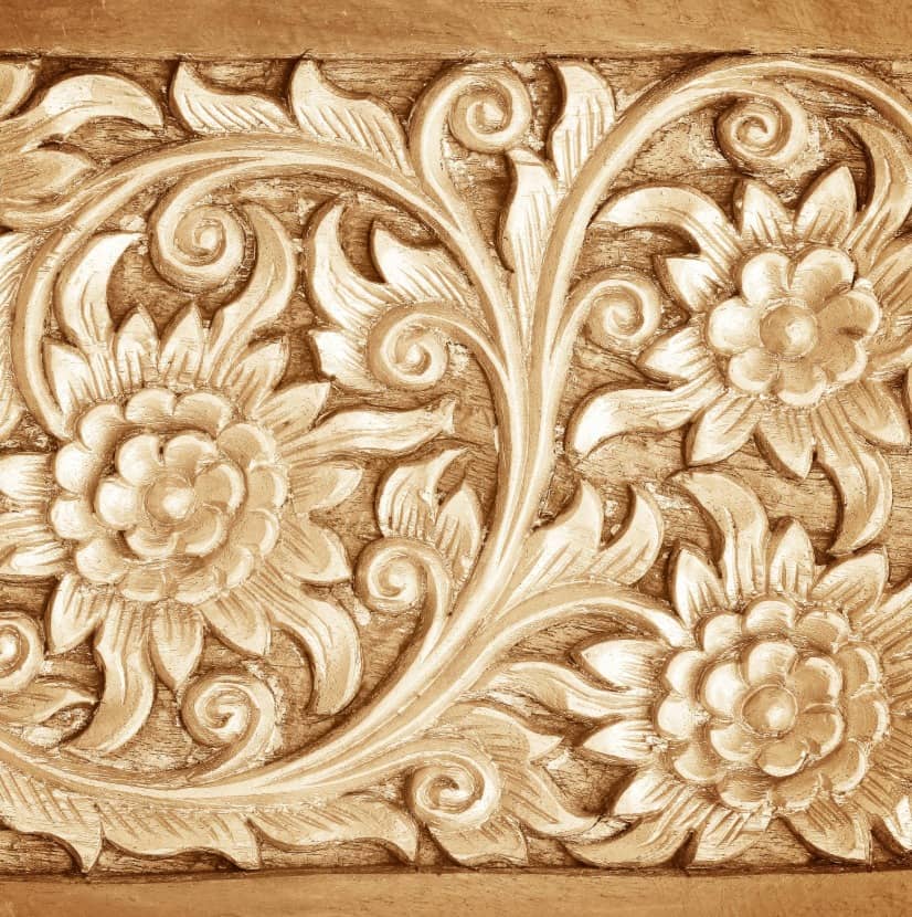 flowers carved into wood to show texture in art